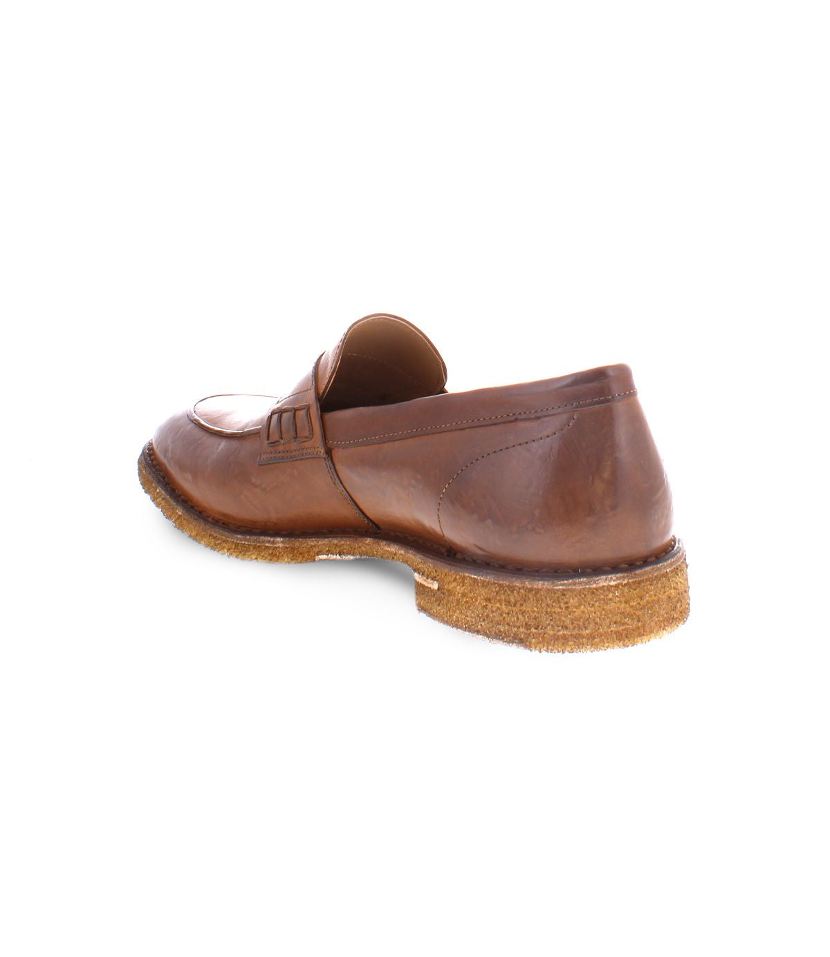 The Envoy by Bed Stu, a timelessly sophisticated brown Italian leather loafer featuring a cork sole, is showcased on a white background, elegantly angled to display the back and side of the handcrafted shoe.