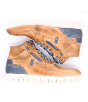 A pair of Bed Stu Galahad brown leather sneakers on a white background.
