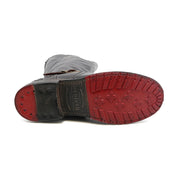 A pair of Bed Stu Glaye men's boots with red soles on a white background.