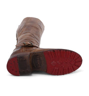 A pair of Glaye boots with red soles. (Brand: Bed Stu)