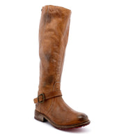 A women's brown riding boot with buckles, the Glaye boot by Bed Stu.