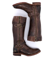A pair of Bed Stu Gogo Lug brown leather boots with buckles and zippers.
