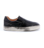 A black leather Hermione slip on sneaker with silver soles by Bed Stu.