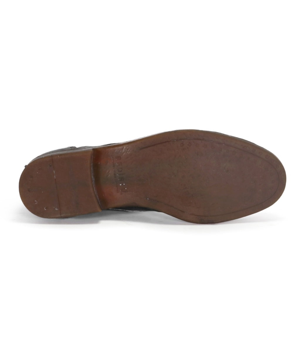 Bottom view of a worn brown vegetable-tanned Illiad shoe sole by Bed Stu.