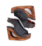 A pair of Imelda black leather wedges with studs on them from Bed Stu.
