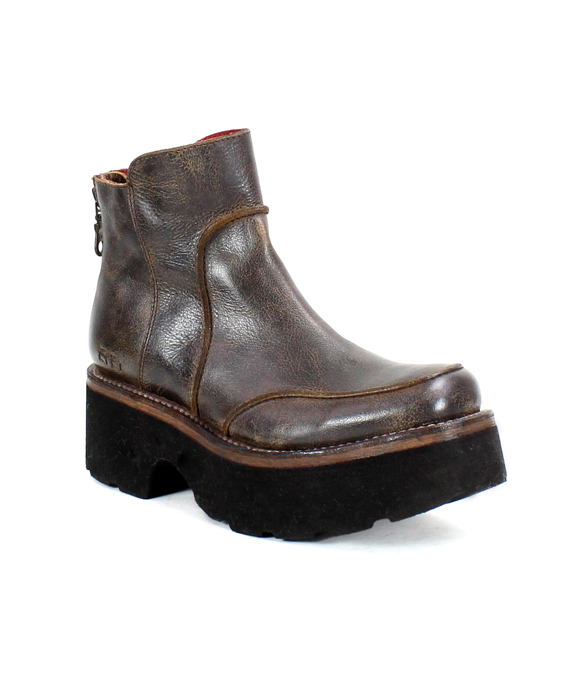 The "Infamy" by Bed Stu is a brown leather platform boot, accented with a chunky outsole and a back zipper, beautifully showcased against a plain white background.