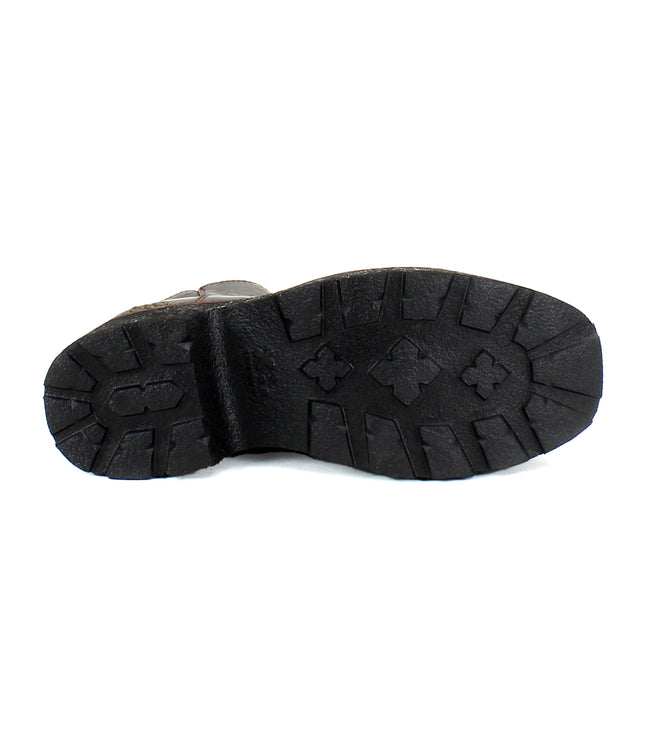 The image showcases the sole of a black Bed Stu Infamy boot with textured patterns, crosses, and grooves designed for traction. This platform boot features a chunky outsole that complements its sleek design.