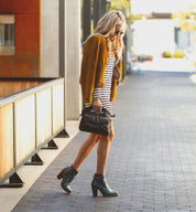 A women's Isla blue leather ankle boot by Bed Stu with a wooden heel.