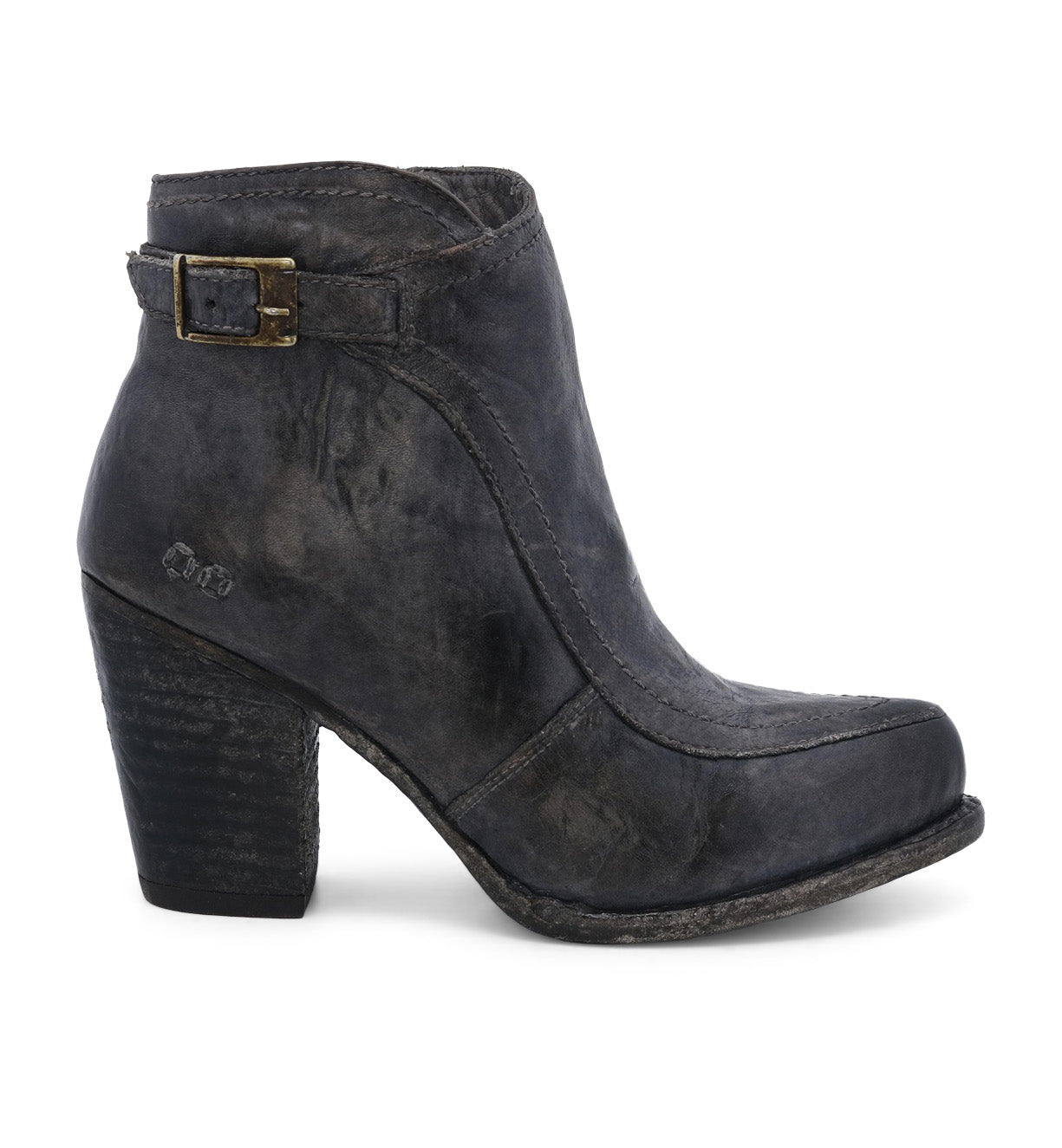 A single leather heeled ankle bootie with a vintage buckle accent against a white background. (Isla by Bed Stu)