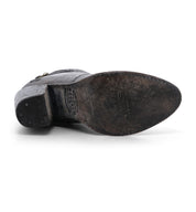 A black leather Isla shoe with a buckle on the side by Bed Stu.