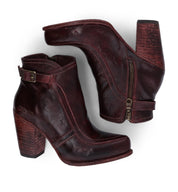 A pair of Bed Stu Isla women's burgundy leather ankle boots.