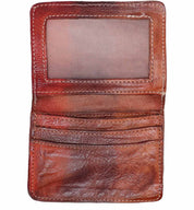 A brown leather Jeor wallet on a white background. Brand: Bed Stu.