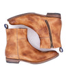 A pair of Bed Stu Kaldi brown leather ankle boots with side zippers, shown from a top view against a white background, designed for comfort.