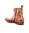 A single brown leather ankle boot with a zipper on the side, isolated on a white background, designed for comfort - Bed Stu Kaldi.