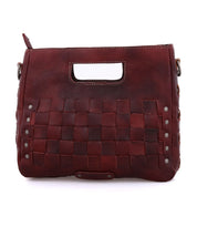 A Keiki by Bed Stu burgundy leather handbag with studded details.