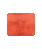 Rectangular orange leather Launcher Mouse Pad with rounded corners and a smooth surface, featuring a suede underside for added grip. Bed Stu logo at the bottom center, perfect for a curated workspace.