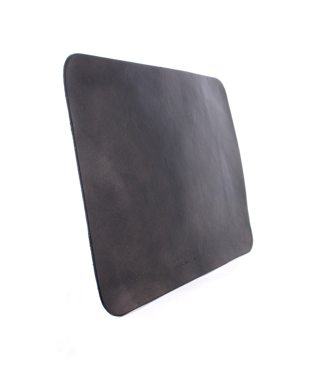 A rectangular black leather mouse pad with slightly rounded corners and a suede underside, perfect for a curated workspace, shown against a white background. This is the Launcher Mouse Pad by Bed Stu.