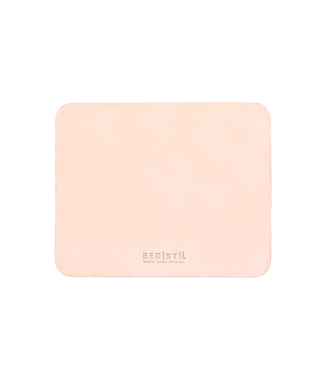 Rectangular beige leather Launcher Mouse Pad with a suede underside, rounded edges, and the brand "Bed Stu" embossed at the bottom center, perfect for a curated workspace.