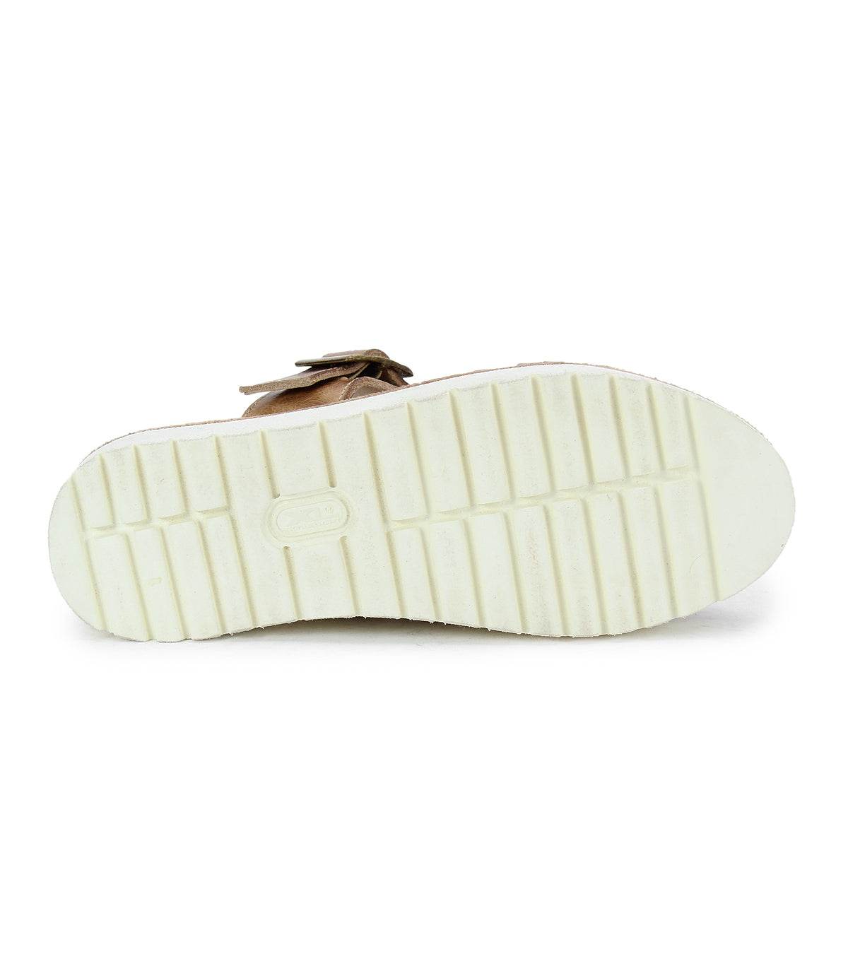The image displays the sole of the Bed Stu Linette sandal, highlighting its white, textured, grooved XL EXTRALIGHT® outsole. It also features a brown strap with hand-woven leather detailing and a centered logo.