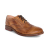 A tan wingtip oxford shoe, called the Lita by Bed Stu.