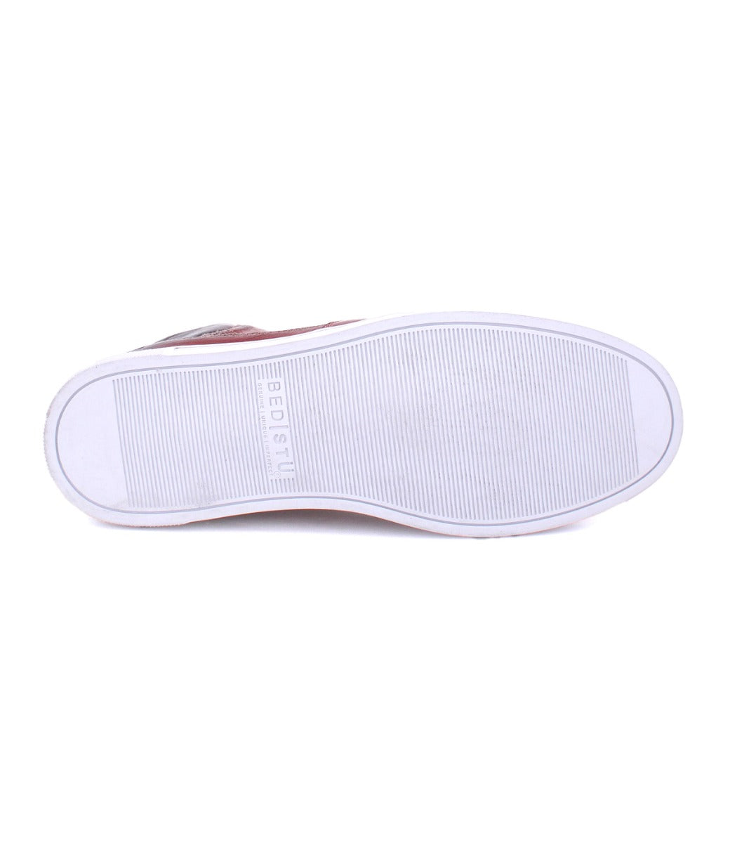 A pair of Lordmind shoes with a white sole and a red sole by Bed Stu.