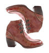 A pair of Bed Stu women's distressed red leather ankle boots.