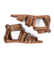 A pair of women's Miya tan leather sandals by Bed Stu with straps and buckles.