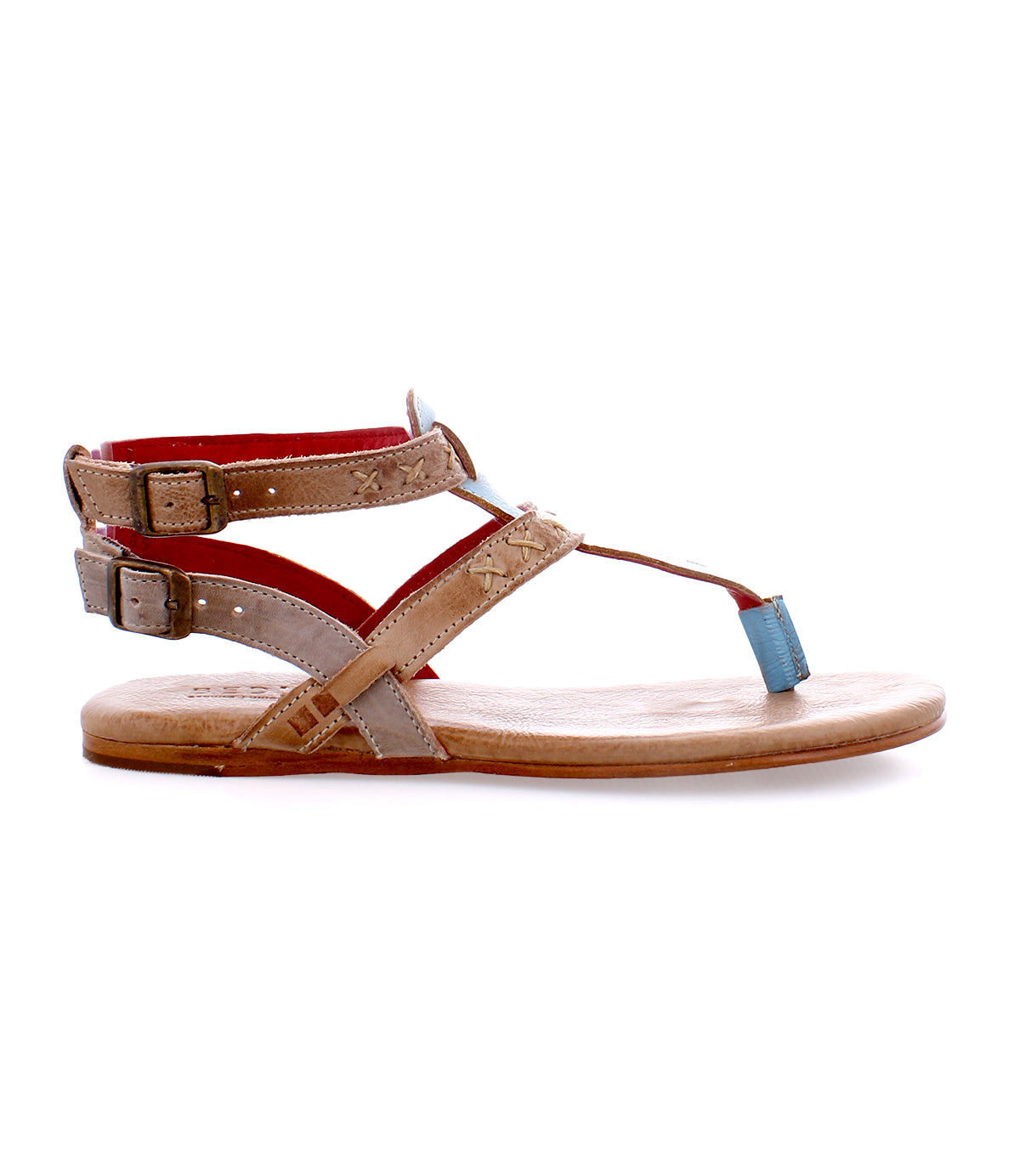 A Moon sandal for women with blue and tan straps.