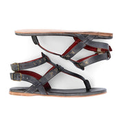 A pair of Moon women's leather sandals with red straps by Bed Stu.
