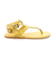 A pair of Moon yellow sandals with buckles and straps by Bed Stu.