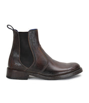 Classic Nando Chelsea boots shown on a white background with Bed Stu leather ankle boots.