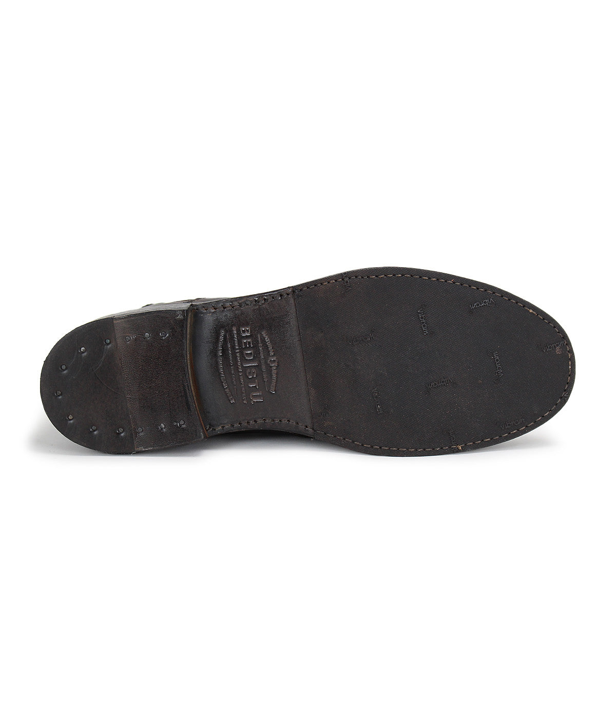 A pair of Bed Stu Nando brown leather ankle boots with studs on the sole.
