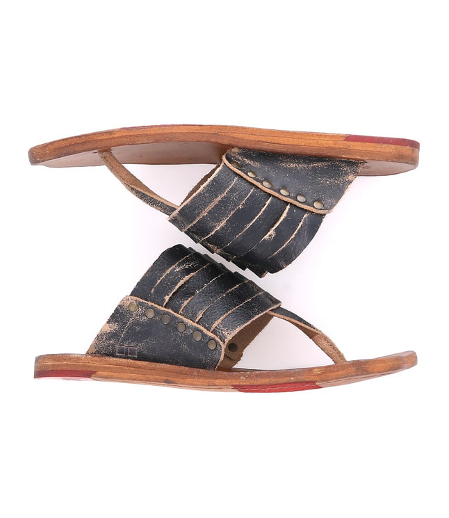 A pair of Nemesis by Bed Stu black leather sandals.