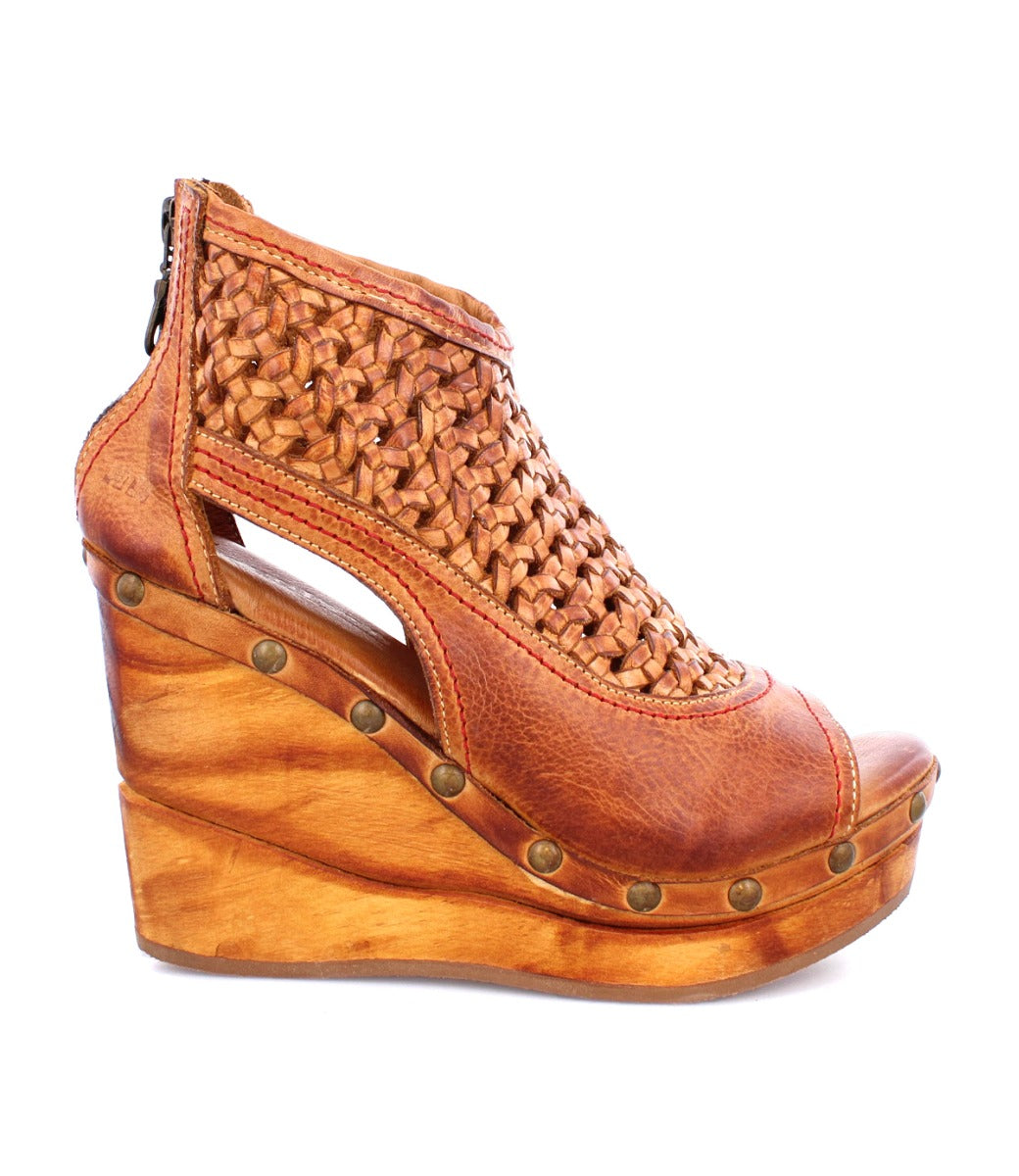 A Bed Stu Odette women's sandal with a wooden platform and woven straps.