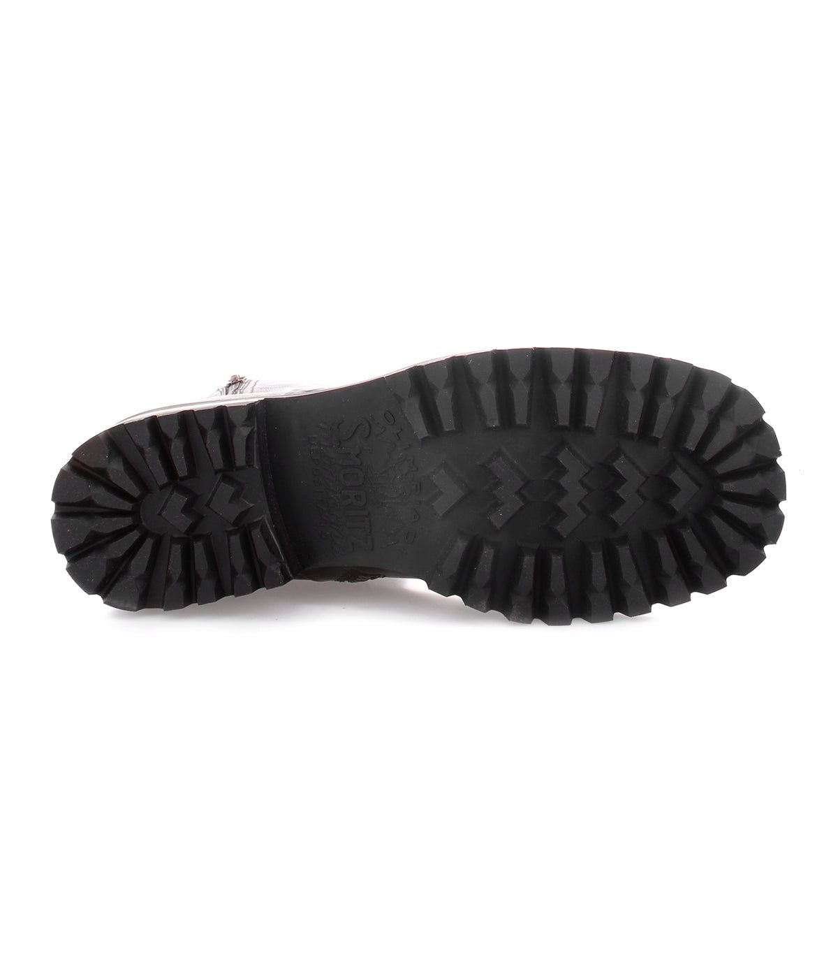 A pair of Bed Stu Ploy Italian leather boots with durable black soles on a white background.