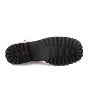 A pair of Bed Stu Ploy Italian leather boots with durable black soles on a white background.