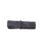 Prepped Leather Wrap from Bed Stu, perfect for securing artist tools with its sturdy strap.