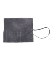 A black leather organizer with a wrist strap, the Prepped Leather Wrap from Bed Stu, featuring multiple stitched slots perfect for holding artist tools.