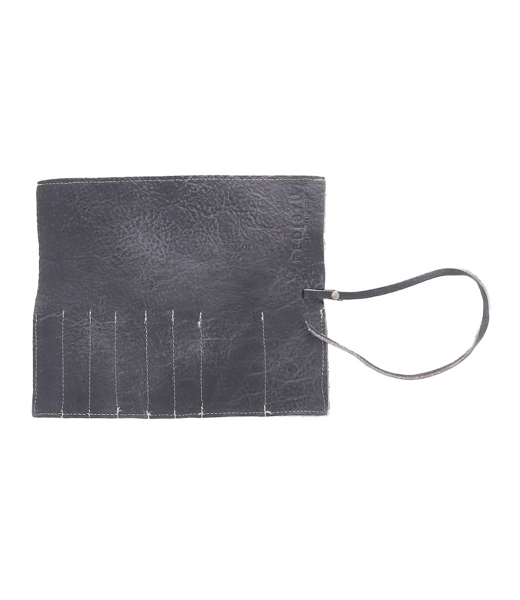 A Prepped black leather clutch with metal pins on it by Bed Stu.