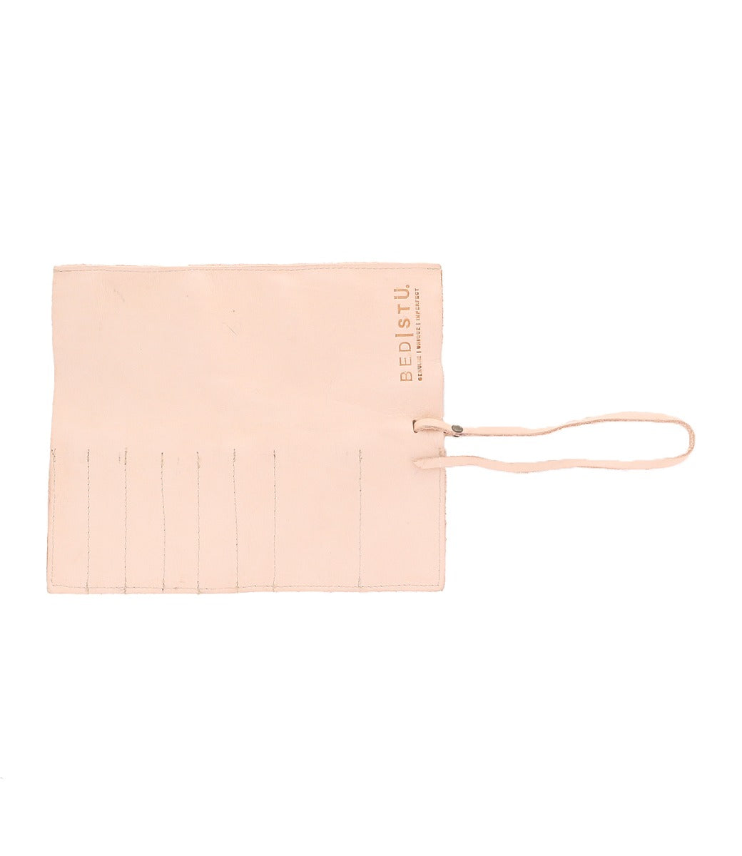 A Prepped by Bed Stu pink leather pouch with a zipper on it.