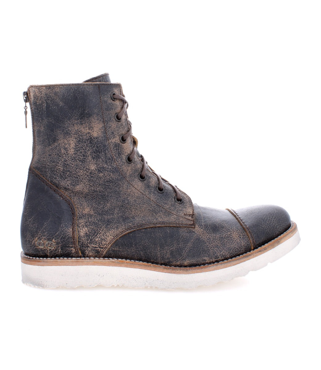 A worn, dark leather lace-up Bed Stu Protege Light Black Lux Boot with a zipper on the side and white lightweight shock-absorbing outsole, isolated on a white background.