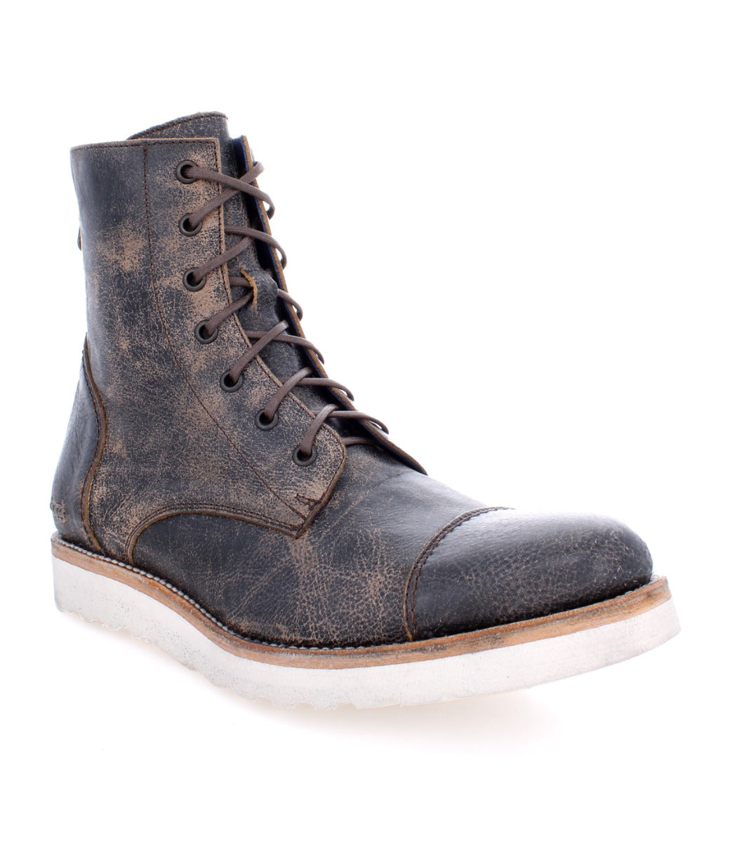 A single Bed Stu Protege Light Black Lux boot with a distressed finish and a white rubber sole, isolated on a white background.