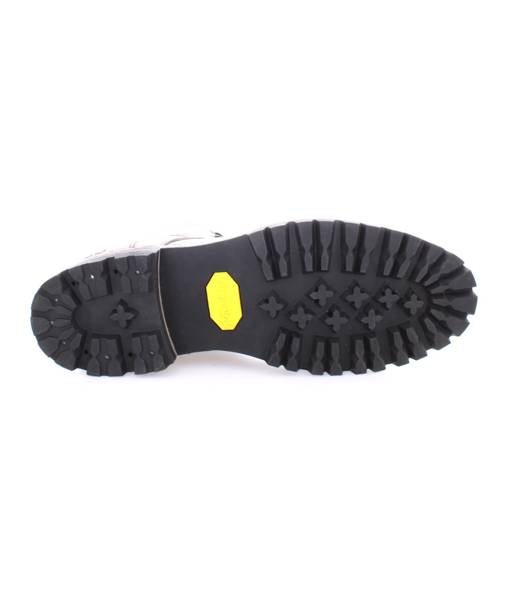 Sole of a Bed Stu Protege Trek hiking boot showing deep tread and a yellow logo detail.