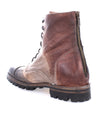 A brown leather combat style boot with a side zipper and rugged sole, shown in profile on a white background, the Bed Stu Protege Trek.