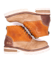 A pair of Bed Stu Quatro III boots on a white background.