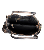 Top view of the Rockaway by Bed Stu, an open leather handbag featuring a spacious interior with a zip-pocket divider for its two main compartments, extra smaller pockets, and a detachable shoulder strap for versatile carrying options.