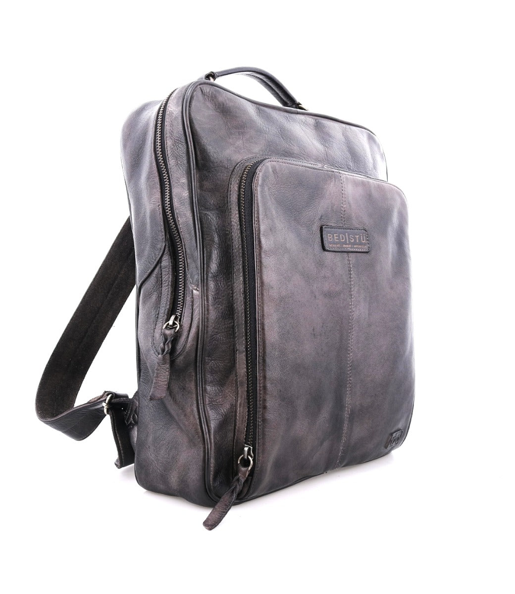 A Rozes by Bed Stu grey leather backpack on a white background.