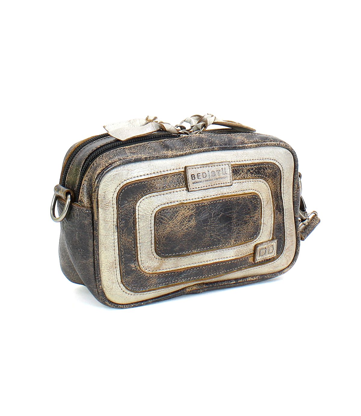 The "Shy" by Bed Stu is a compact crossbody bag with a small rectangular design, featuring vintage-style contrasting leather with a worn texture and multiple zipper compartments for excellent organization.