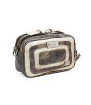 The "Shy" by Bed Stu is a compact crossbody bag with a small rectangular design, featuring vintage-style contrasting leather with a worn texture and multiple zipper compartments for excellent organization.