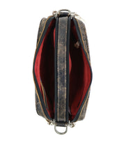 Top view of an open Bed Stu Shy crossbody bag made from textured dark leather, featuring two organizational compartments lined in red fabric and adorned with silver hardware.